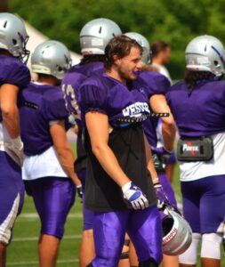 Photo of Josh Ross playing football for the Western Mustangs