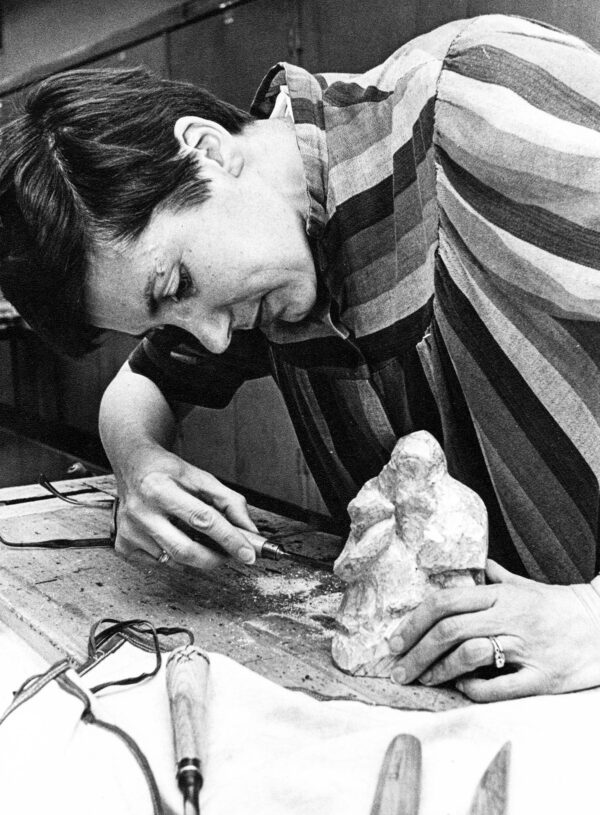 Halina Robinson had a long­standing interest in the arts. Here, she chisels a piece of soapstone in a night school class.