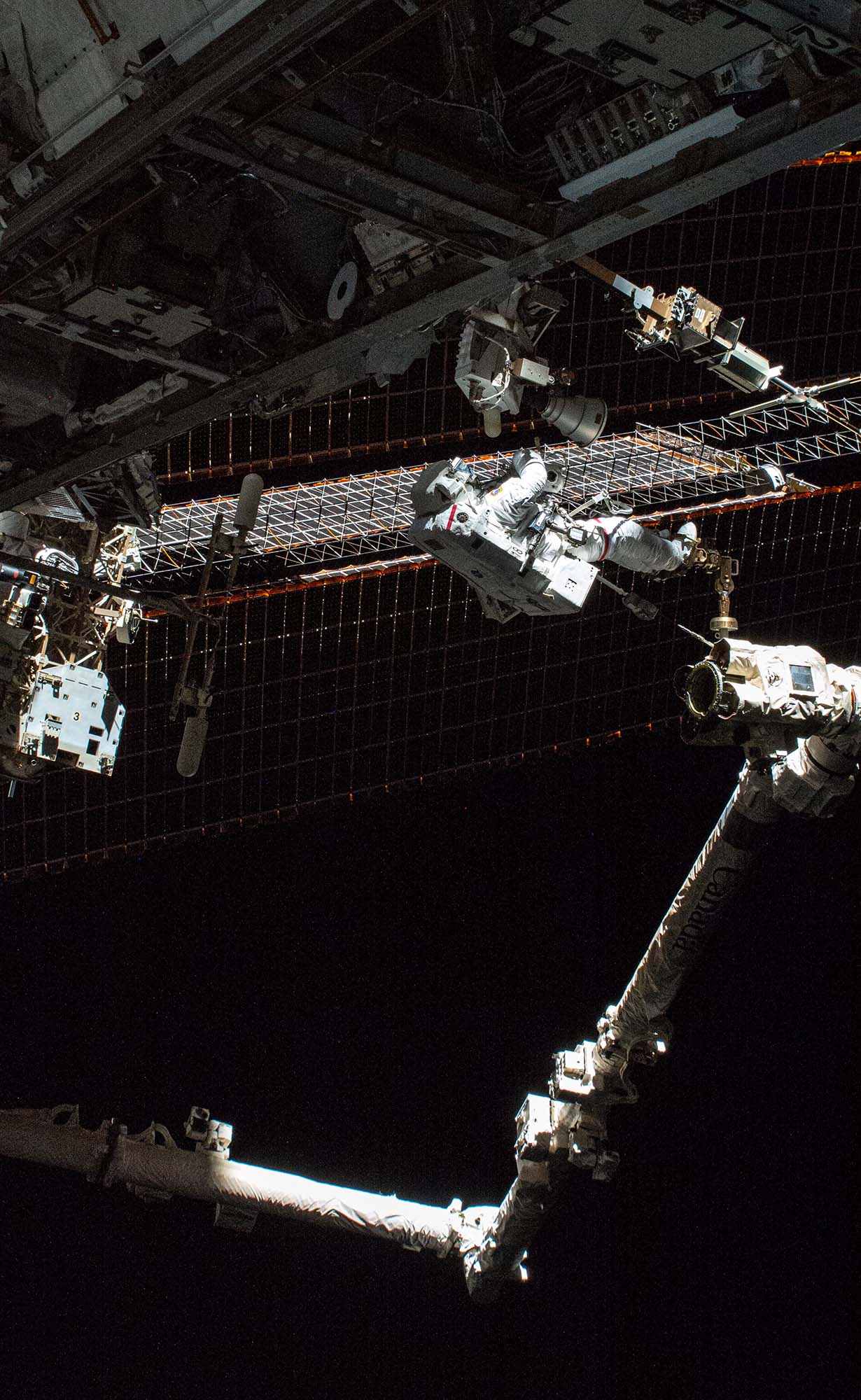 Photo of NASA spacewalker Thomas Marshburn attached to the Canadarm2 robotic arm, Dec. 2, 2021.