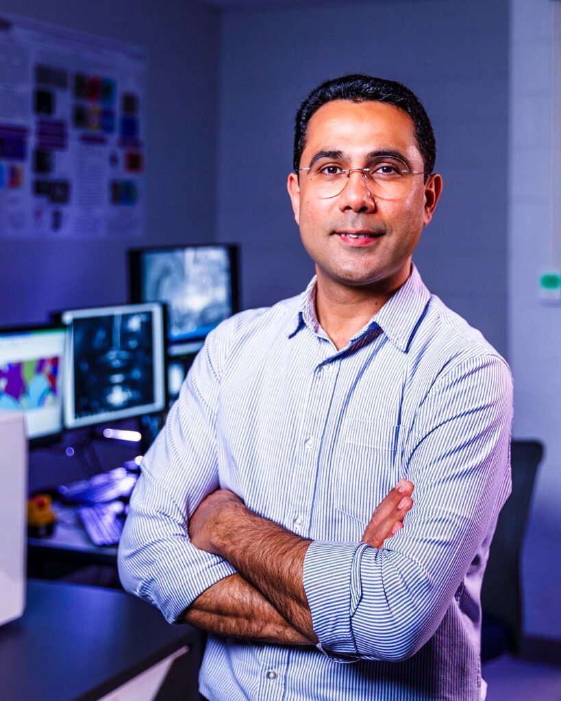 Photo of Hamid Abdolvand in the scanning electron microscope lab, Spencer Engineering Building